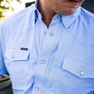 The Padre blue button-up shirt with dual chest pockets and snap closures