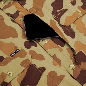 closeup of phone going into chest pocket