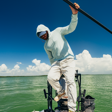man on boat wearing sea grass hoodie