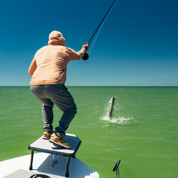 man catching fish wearing sunset hoodie
