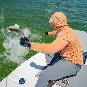 man with fish wearing sunset hoodie