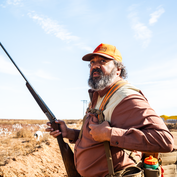 Man Upland hunting while wearing The Pheasant Hat