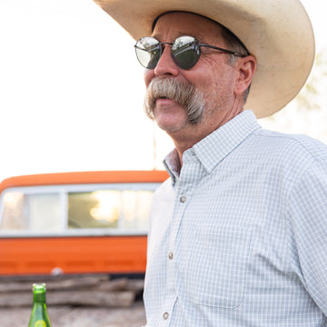 Man wearing micro grid grey button up shirt