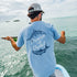 Man fishing on boat with tarpon and bonefish t-shirt on