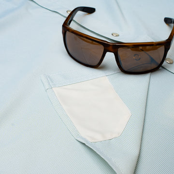 Hidden sunglass cloth on pearl snap shirt