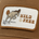 Brown cap with an embroidered patch showing a leaping kangaroo and the words WILD AND FREE