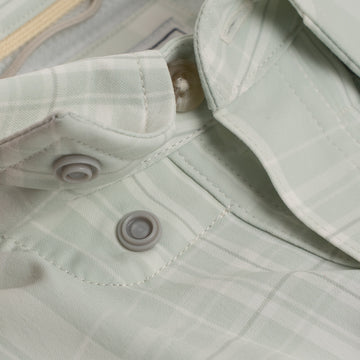 hidden snap collar on green button down shirt