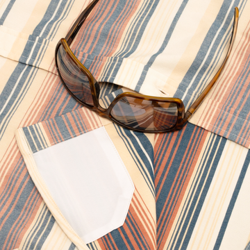 The Pack Mule shirt in Serape Stripes with a white chest pocket and colorful woven fabric pattern