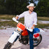 man wearing the 150 shirt on a dirtbike