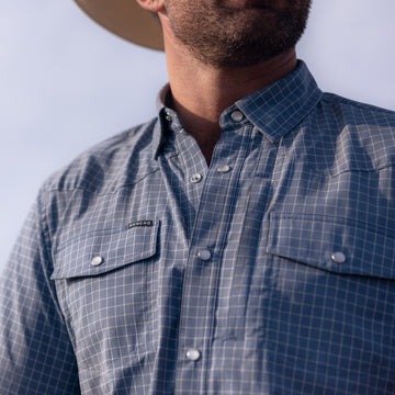 man wearing short sleeve slate blue check shirt