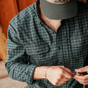 The Acadia teal and white plaid men's outdoor shirt with long sleeves, button front, and chest pockets