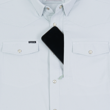 The Alpine white shirt with button-down collar, flap chest pockets, and contrasting black front panel