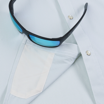 The Alpine shirt with blue sunglasses resting on its pocket