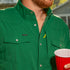 closeup of man holding cup wearing the amen shirt