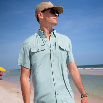 man on beach wearing the antilles shirt