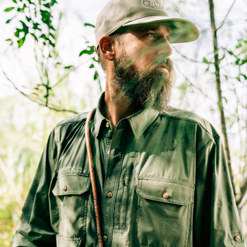 man wearing green long sleeve shirt