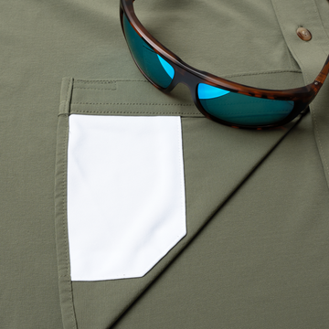 sunglasses with lens cleaner on shirt