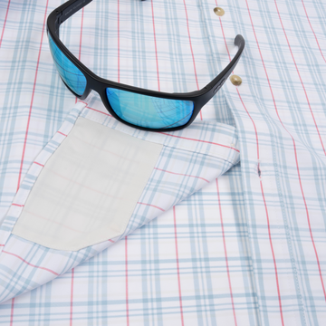 sunglasses with lens cleaner on shirt