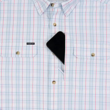 phone in chest zipper pocket of shirt