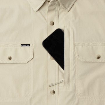phone in chest zipper pocket of shirt