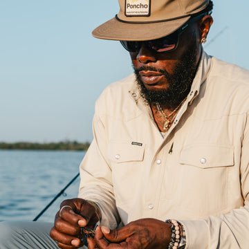 Man on water tying lure