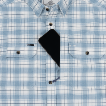 The Blue Bison light blue and white plaid shirt with a phone partially tucked into the chest pocket.