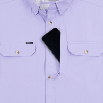 Phone in chest zipper pocket of shirt
