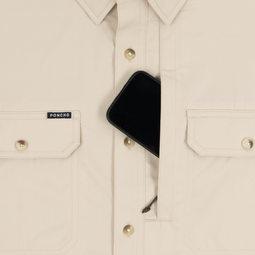 Phone in chest zipper pocket of shirt