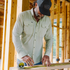 man measuring wood wearing tan long sleeve shirt