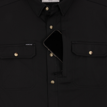 Phone in chest zipper pocket of shirt