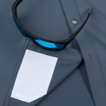 The Busted Prop men's slate blue outdoor shirt with white chest pocket and blue lens sunglasses