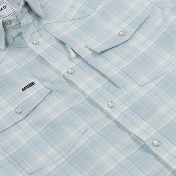 Light blue plaid button-up shirt with snap buttons and chest pockets