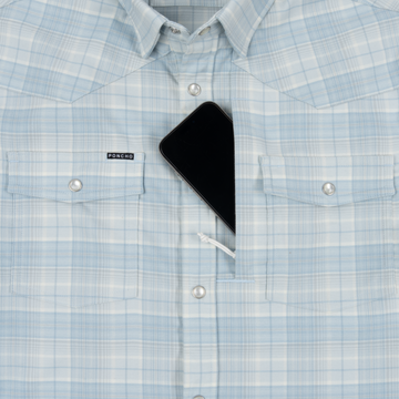 Light blue plaid shirt with black smartphone partially tucked inside the front pocket