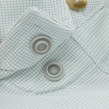 Close-up of buttons and fabric texture on The Carolina Rig shirt in a subtle green check pattern.