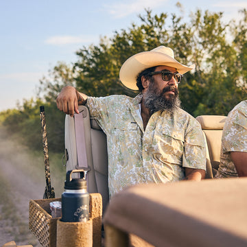 man riding on dirt road wearing south texas camo