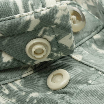 Closeup of collar snaps on collar of shirt