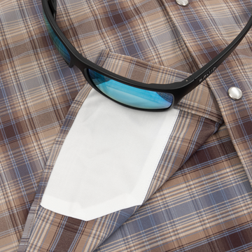 sunglasses with lens cleaner on shirt