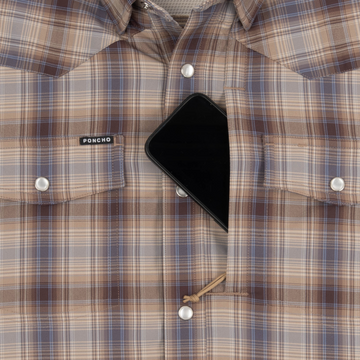 Phone in chest zipper pocket of shirt