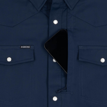 Phone in chest zipper pocket of shirt