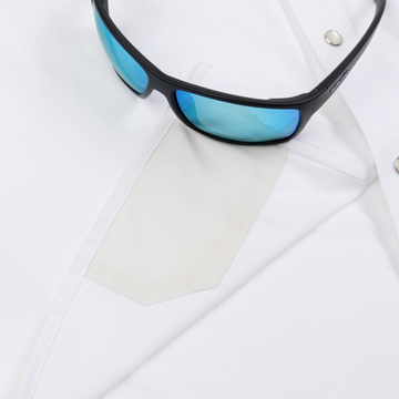 sunglasses with lens cleaner on shirt