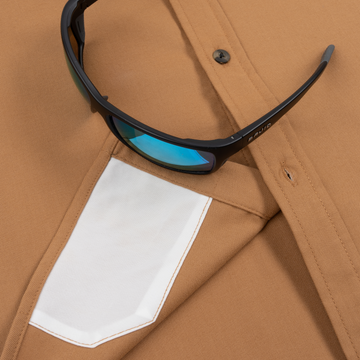 The Ditch Chicken tan with moss green men's outdoor shirt featuring a button front and chest pocket