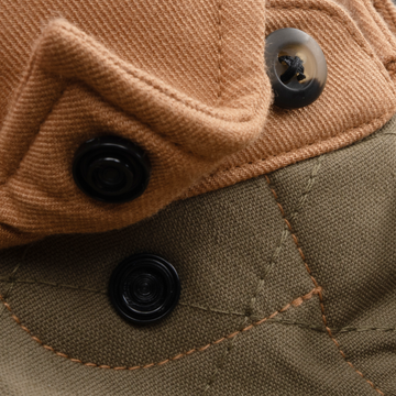The Ditch Chicken tan with moss green men's outdoor shirt closeup showing textured fabric and black buttons