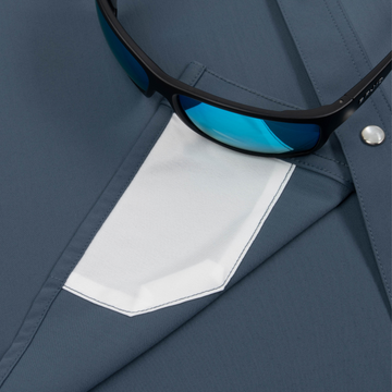 sunglasses with lens cleaner on shirt