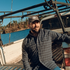 The Doryman dark blue slate plaid men's outdoor shirt with chest pockets on a fishing boat
