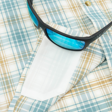 sunglasses with lens cleaner on shirt