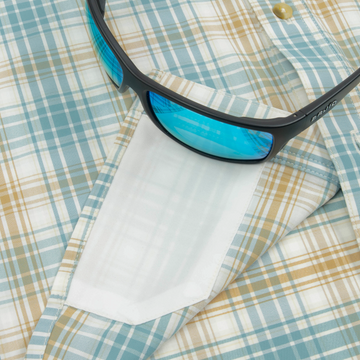 sunglasses with lens cleaner on shirt