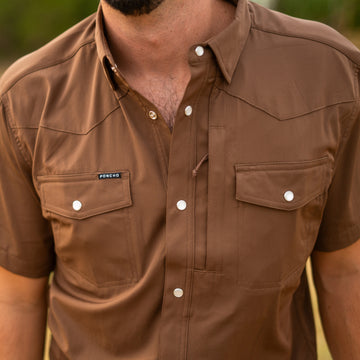 man wearing brown pearl snap shirt