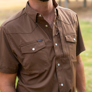 man wearing the dumas brown pearl snap shirt