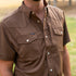 man wearing the dumas brown pearl snap shirt