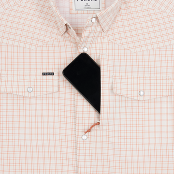 Phone in chest zipper pocket of shirt